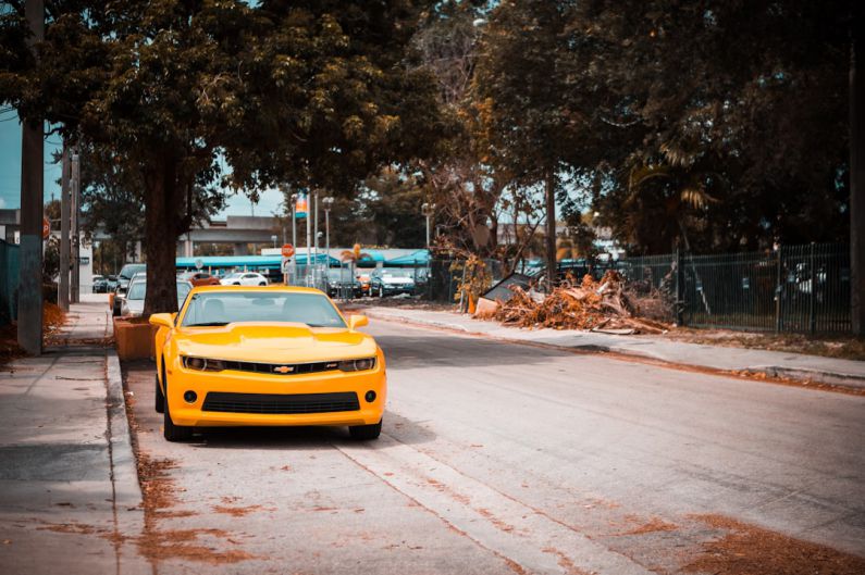 Camaro Reputation - yellow vehicle near tree